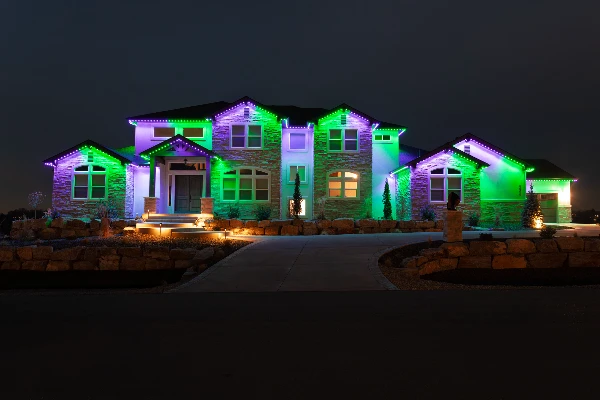 Deep blue Hanukkah lighting along the gables of a two-story home